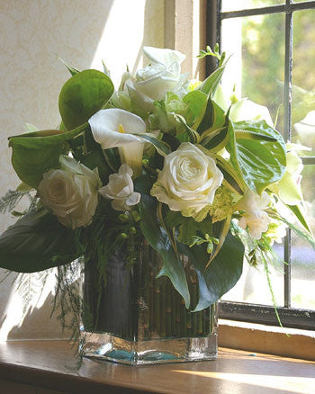 ivory Roses, Lisianthus, lime green Anthurium or Blooms with other seasonal flower and foliage.
